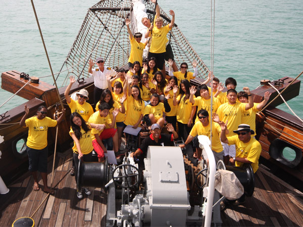 Tall ship crew working together
